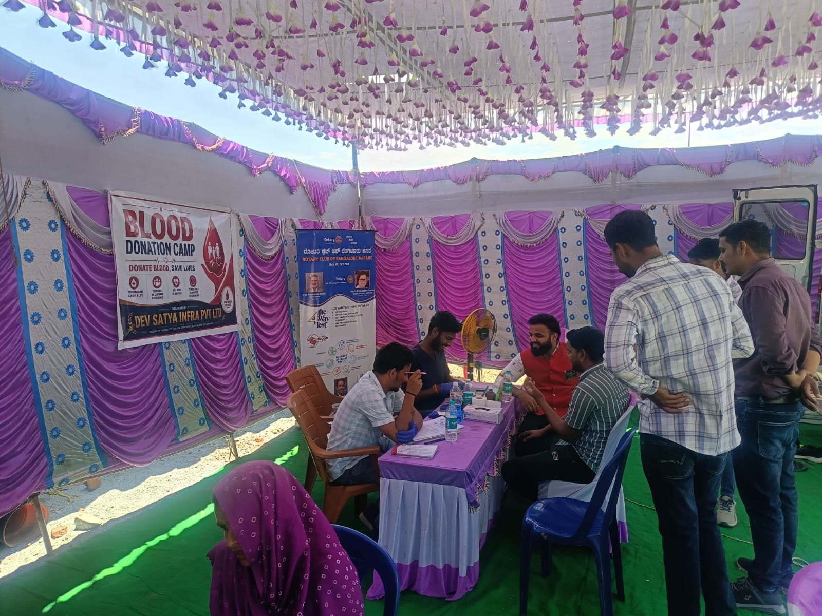 Community members taking part in a blood donation camp