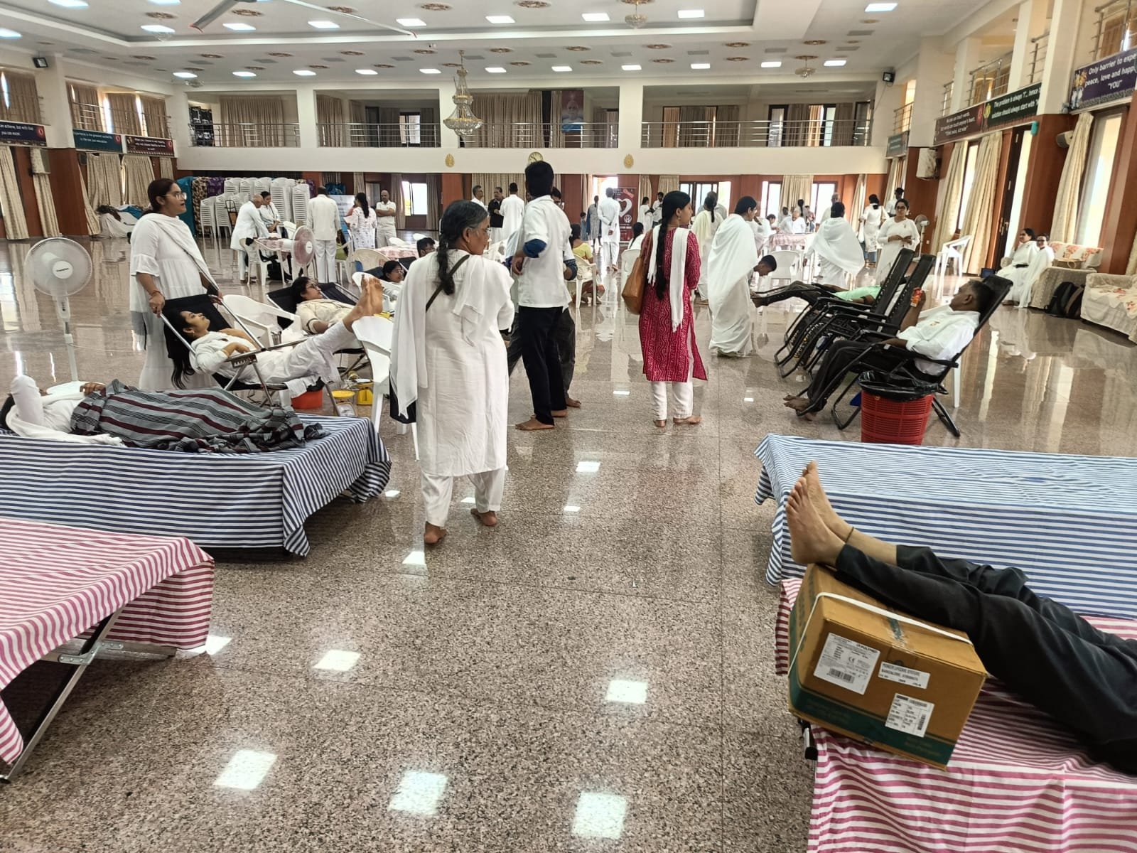 Donors and medical staff at a community blood donation drive